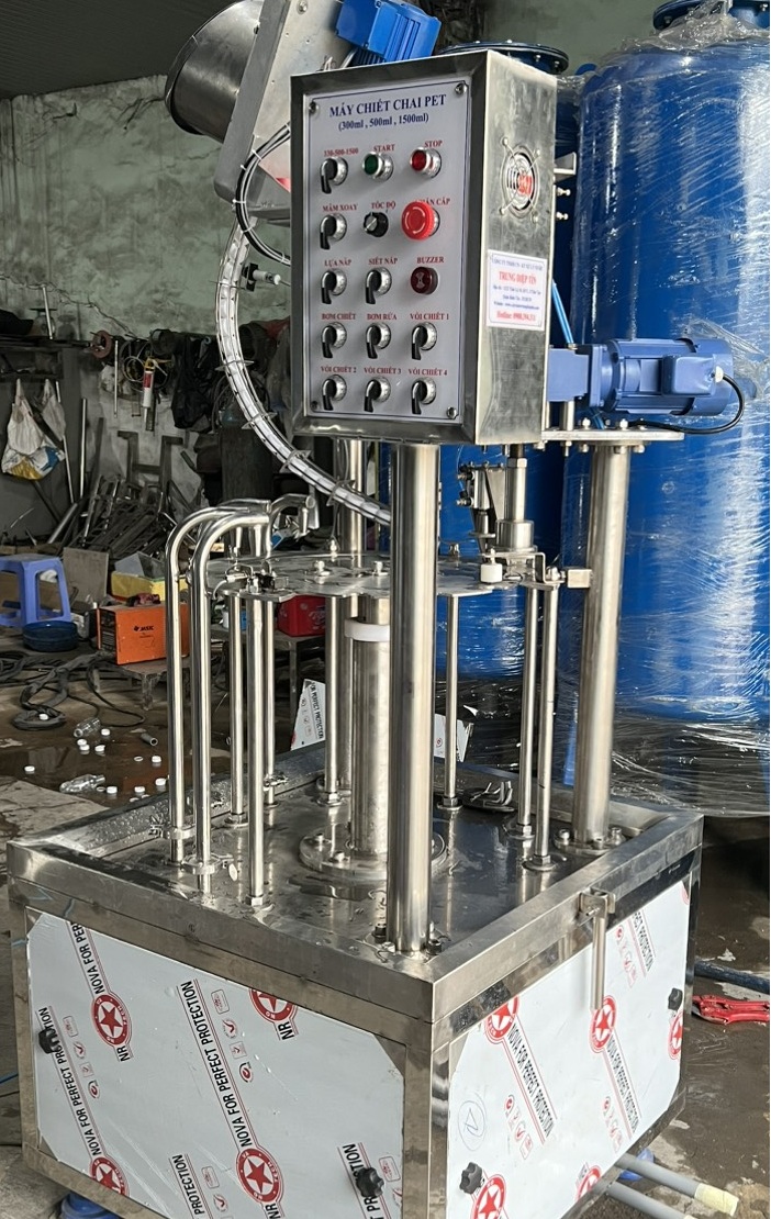 Máy chiết chai bình bình tân